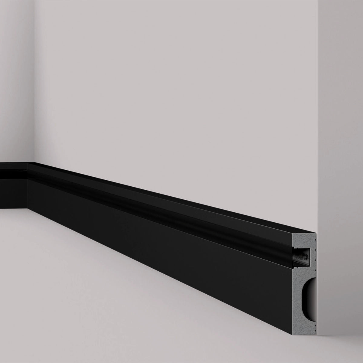 IL11 2M BLACK WALLSTYL SKIRTING BOARD - Skirtings with cable channel owner detail on a light-colored wall | DecorMania UK | DecorMania UK